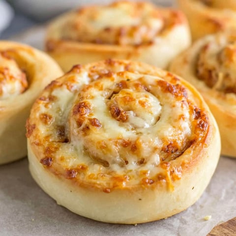 A plate of pastries with cheese.