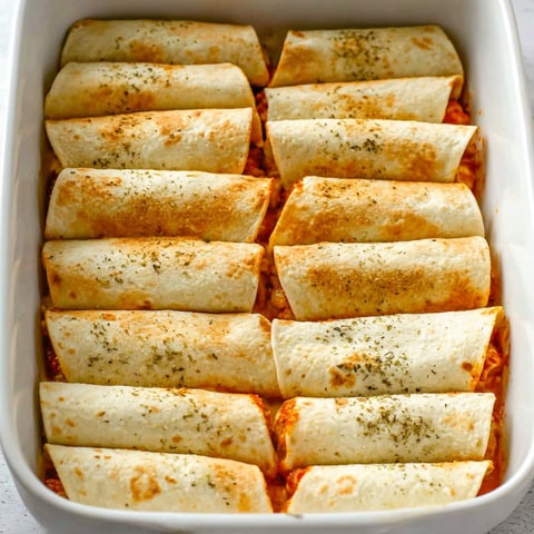 A dish of pizza roll ups.