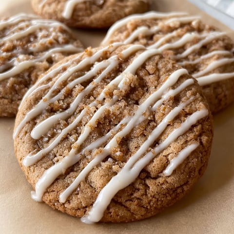 A close up of a cookie with white icing.