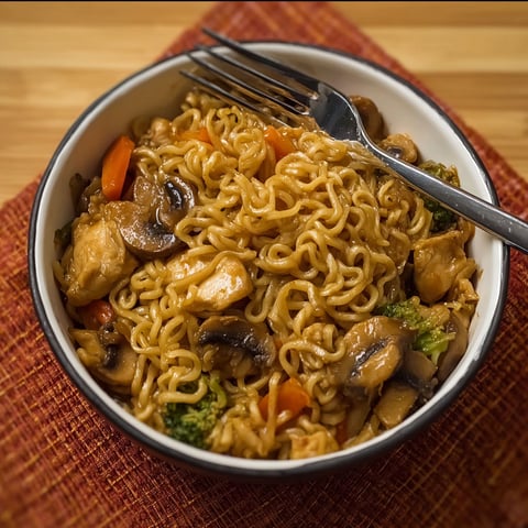 A bowl of chicken ramen stir fry.