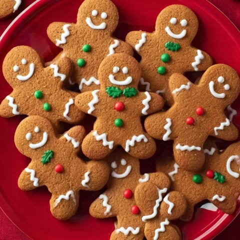 A plate of gingerbread men cookies.