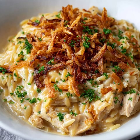 A bowl of French Onion Chicken Orzo Casserole.