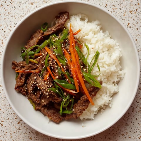A bowl of beef bulgogi with rice.