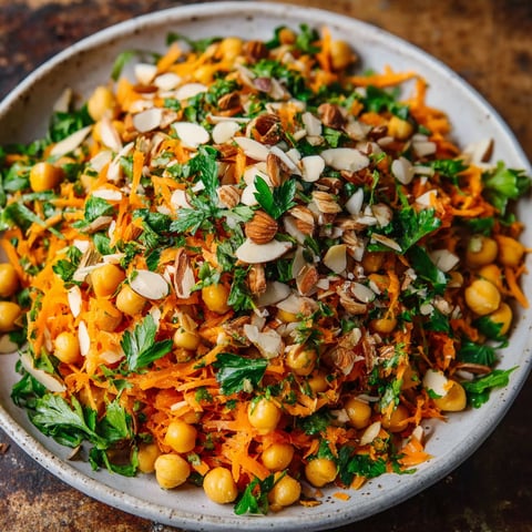 A bowl of food with a mix of vegetables and nuts.