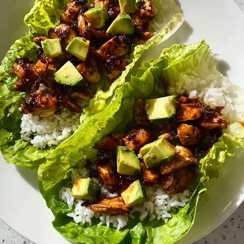 A plate of food with rice and avocado.