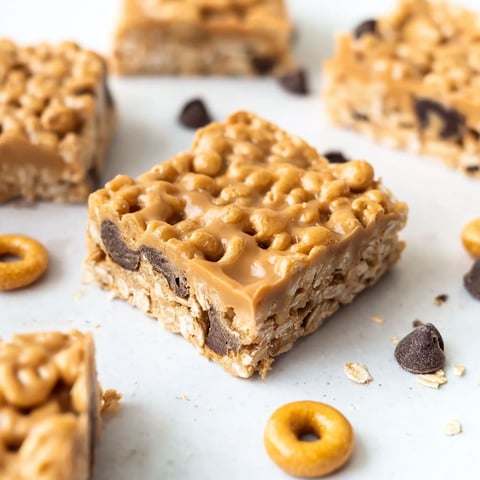 A close up of a no-bake chocolate peanut butter cheerio bar.